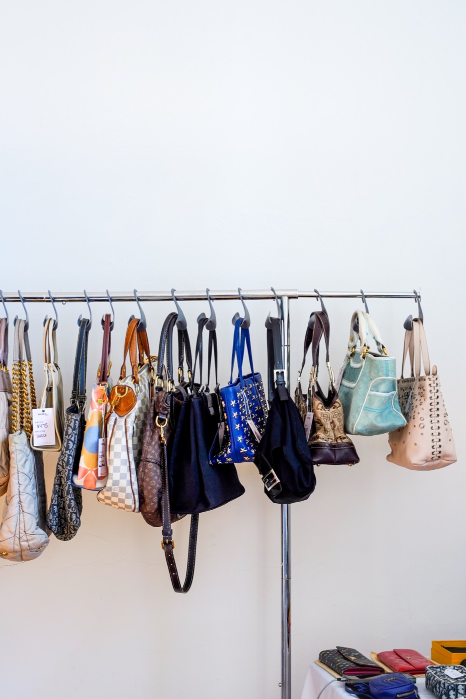 Vintage designer bags hanging on a rack